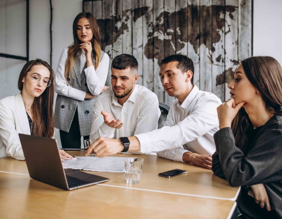 Group of people working out business plan in an office